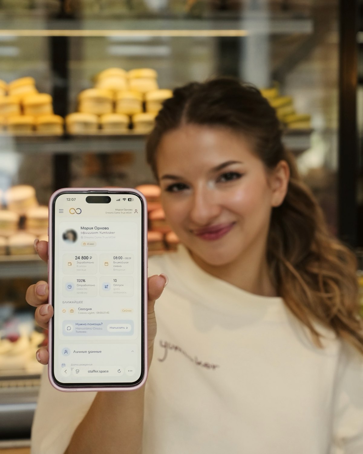 A team member showing today’s shift on her phone